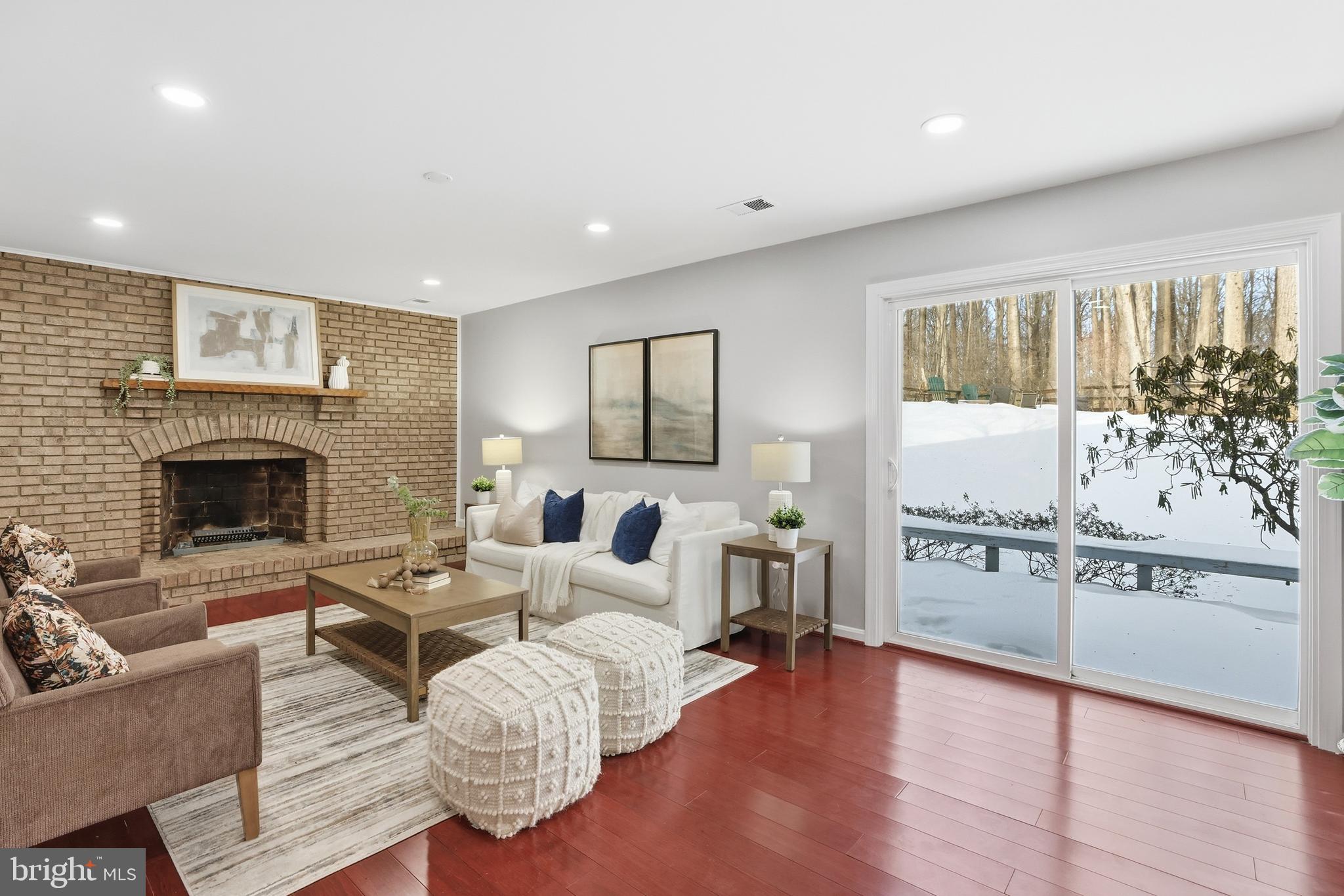 14740 Locustwood Lane Silver Spring, MD 20905 - Photo 14 of 46 a living room with furniture and a fireplace