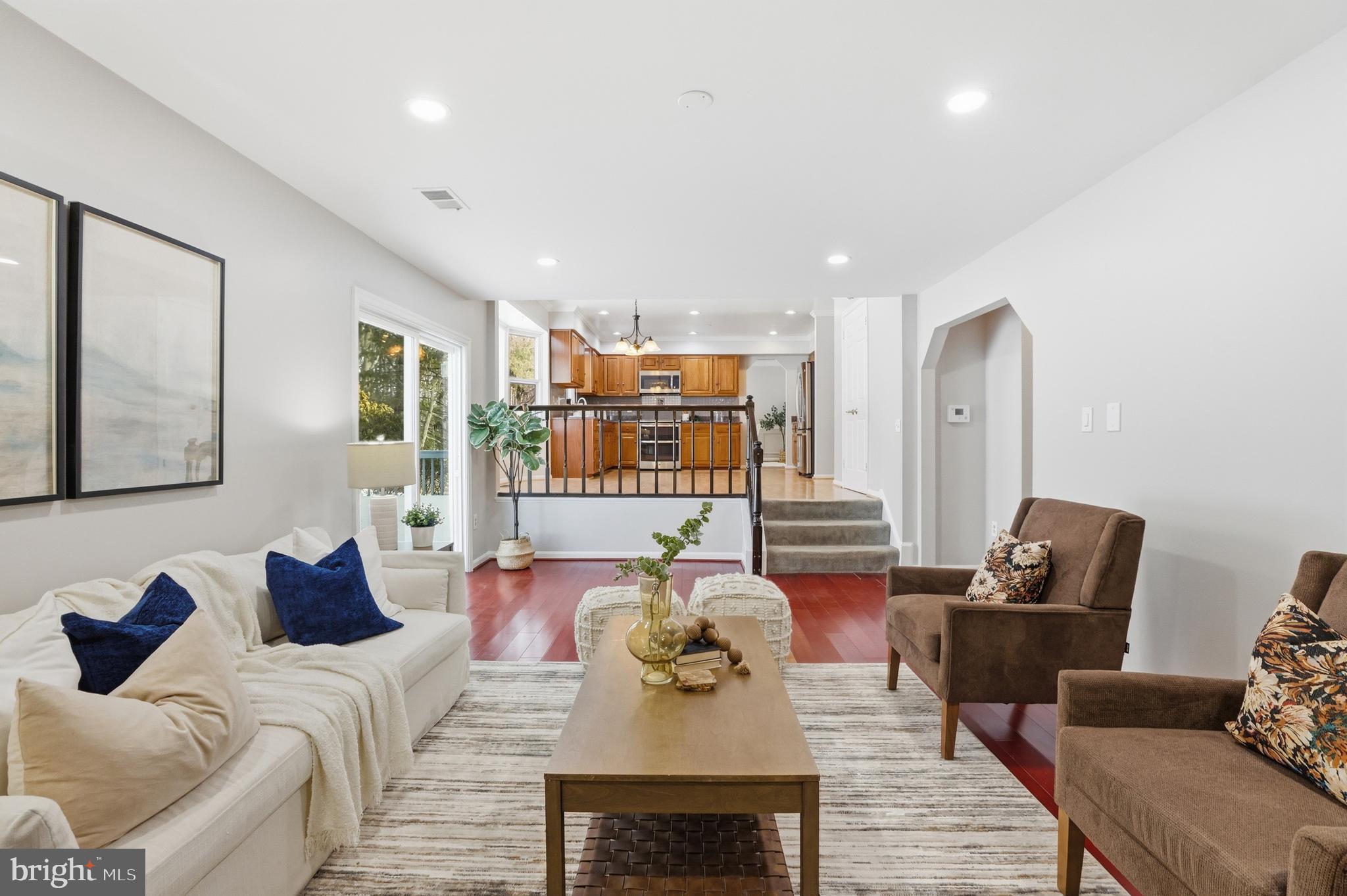 14740 Locustwood Lane Silver Spring, MD 20905 - Photo 16 of 46 a living room with furniture and wooden floor