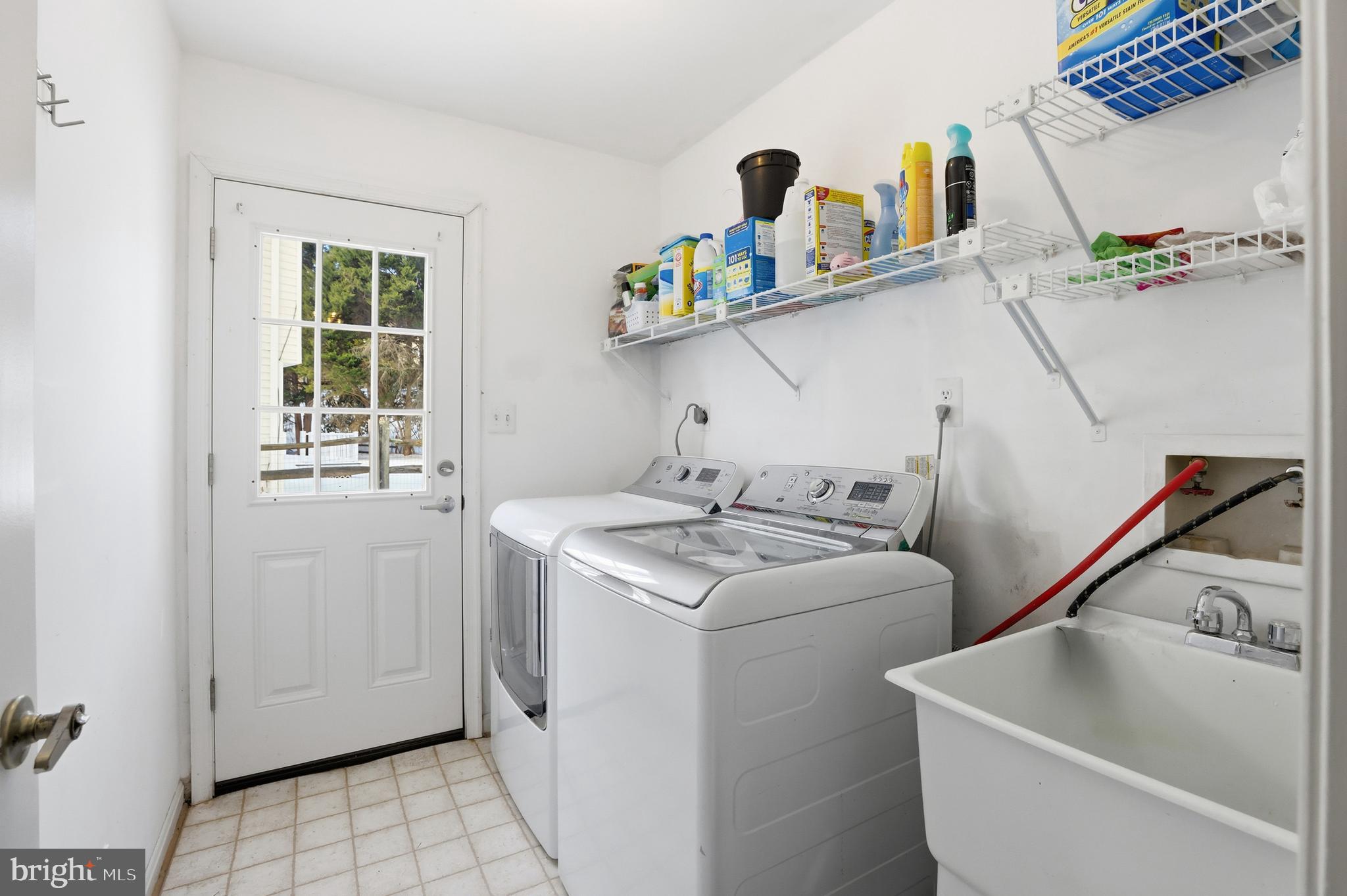 14740 Locustwood Lane Silver Spring, MD 20905 - Photo 18 of 46 a utility room with dryer and washer