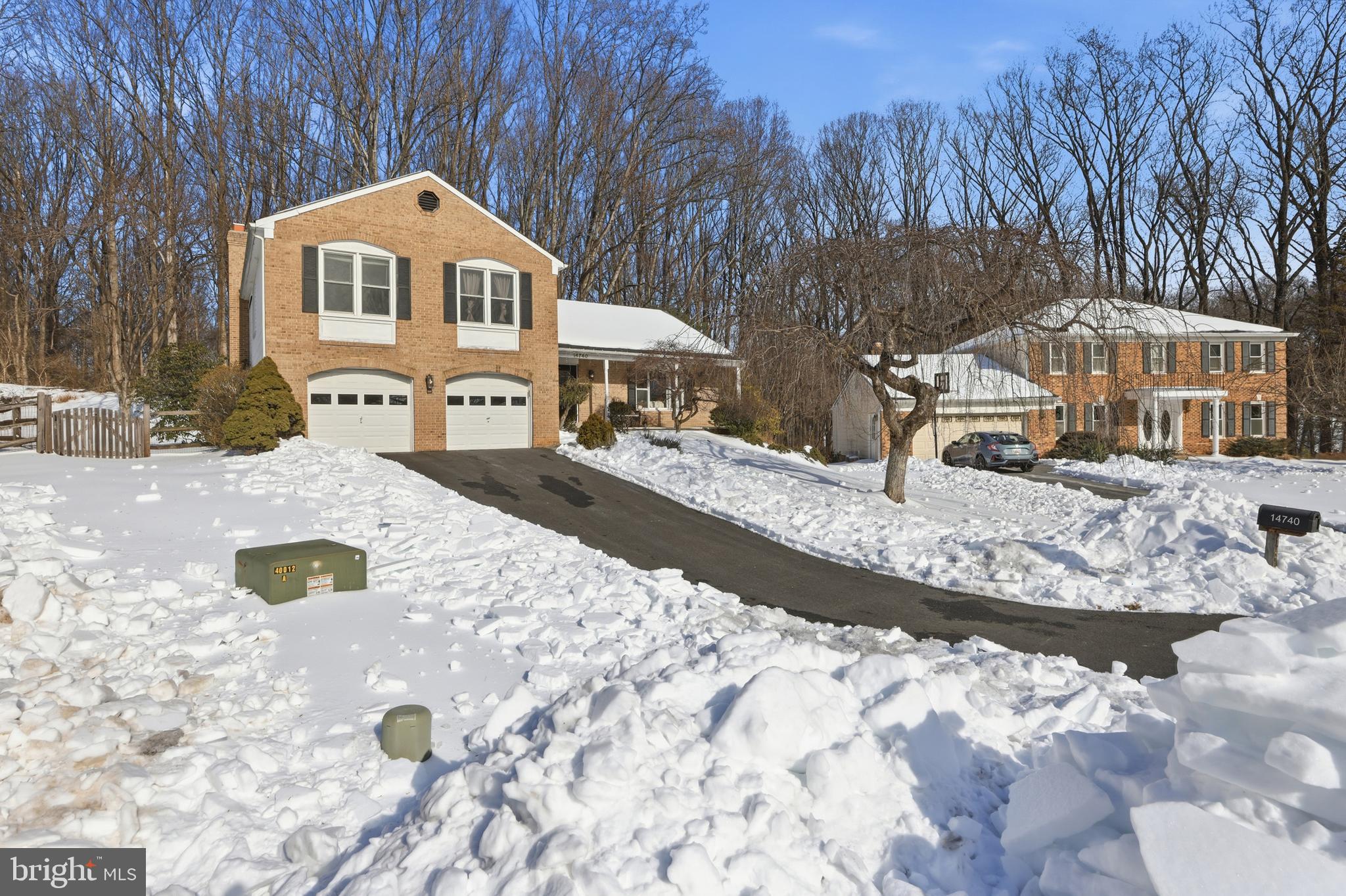14740 Locustwood Lane Silver Spring, MD 20905 - Photo 2 of 46 a front view of a house with a yard
