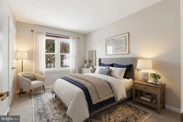 a bedroom with bed and a window