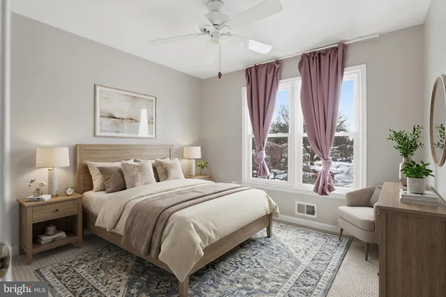 a bedroom with a large bed and a couch