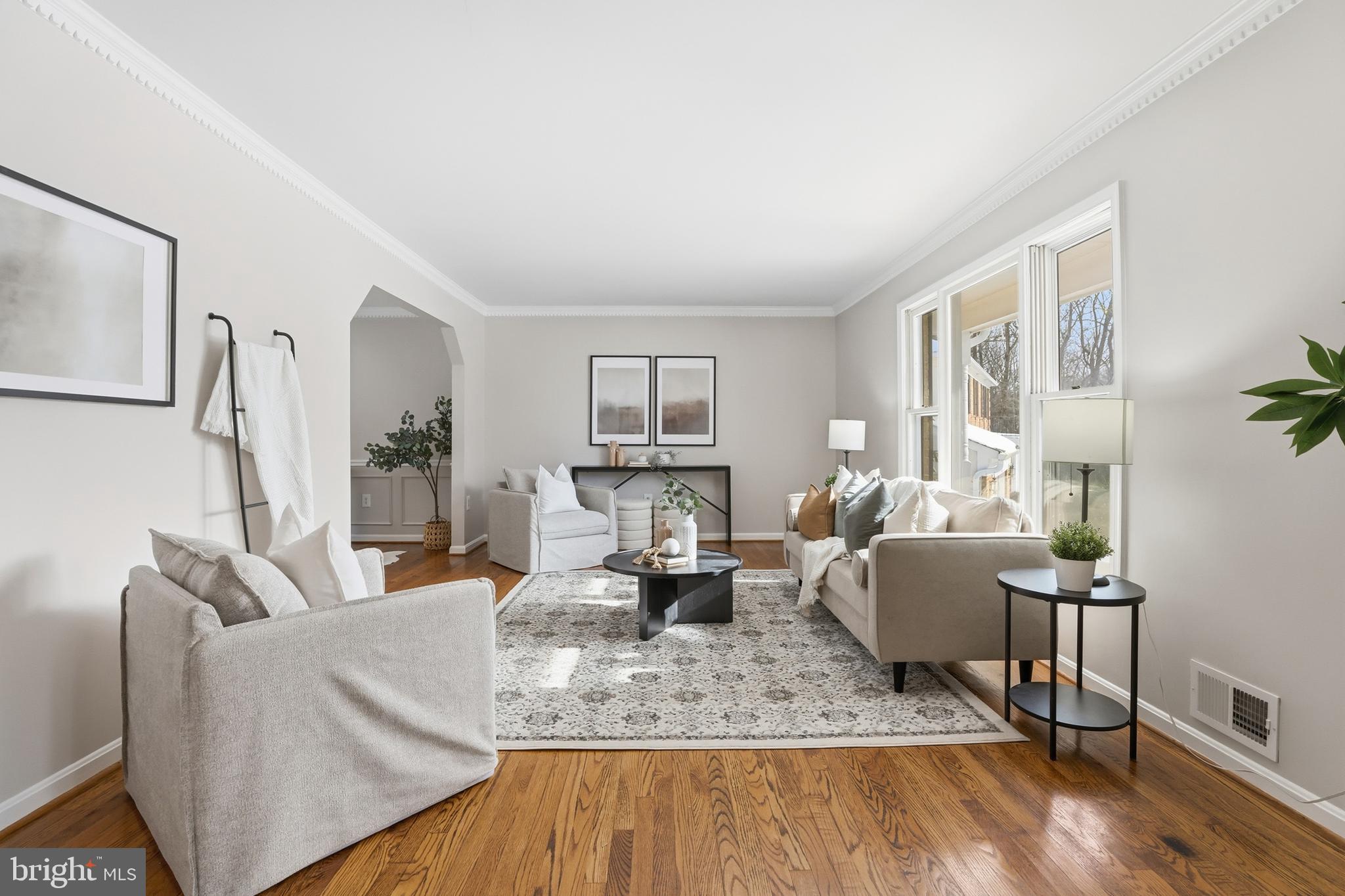 14740 Locustwood Lane Silver Spring, MD 20905 - Photo 7 of 46 a living room with fireplace furniture and a wooden floor