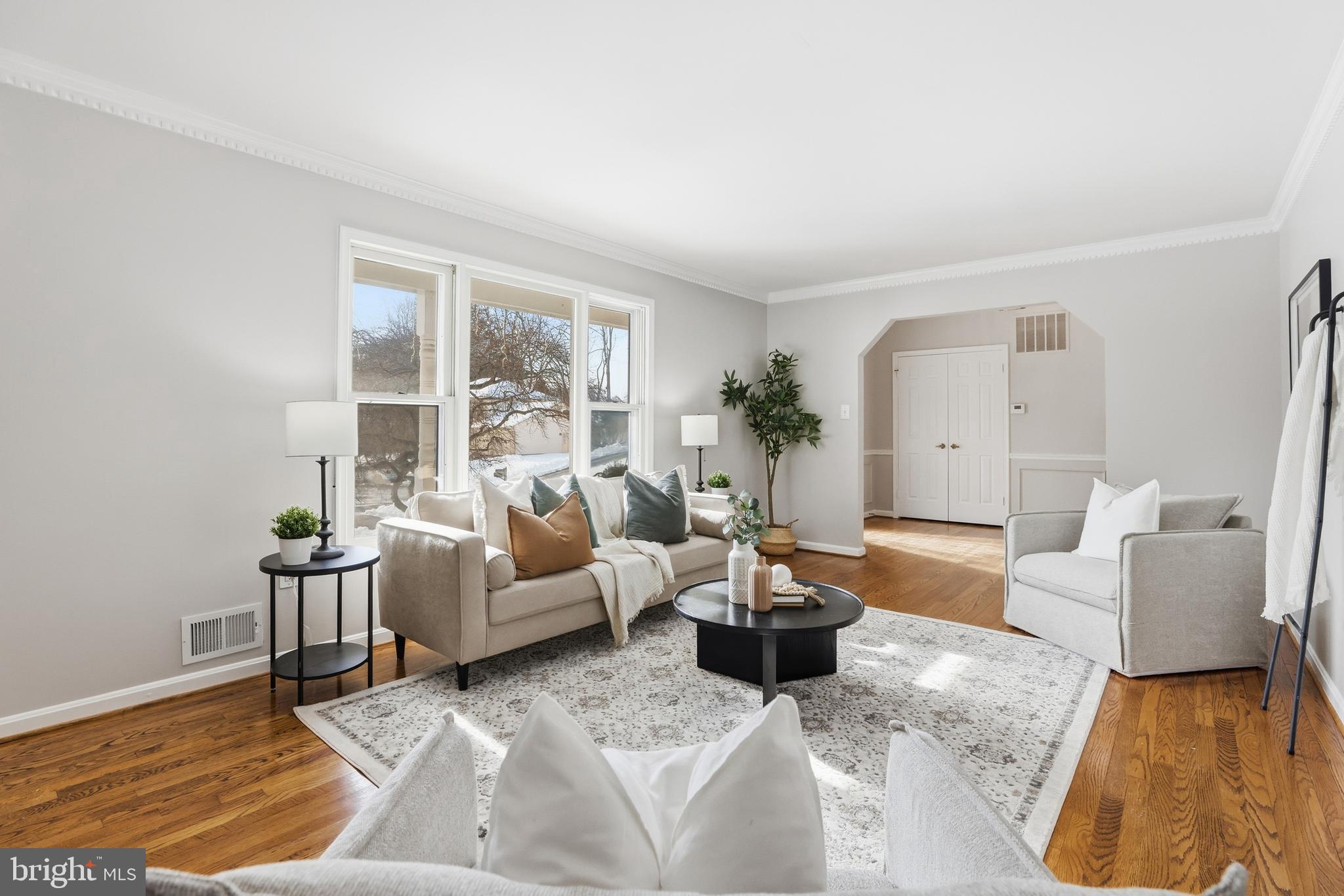 14740 Locustwood Lane Silver Spring, MD 20905 - Photo 8 of 46 a living room with furniture and a large window