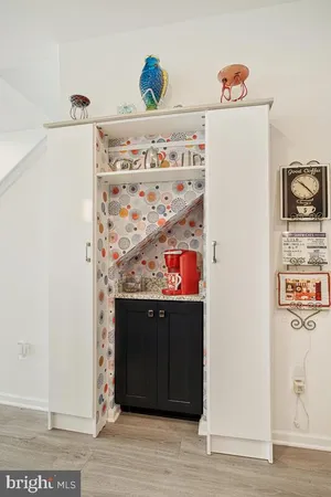 a kitchen with granite countertop cabinets stove and microwave