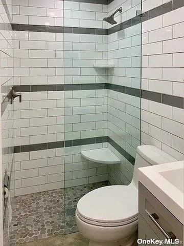 a bathroom with a toilet and a sink