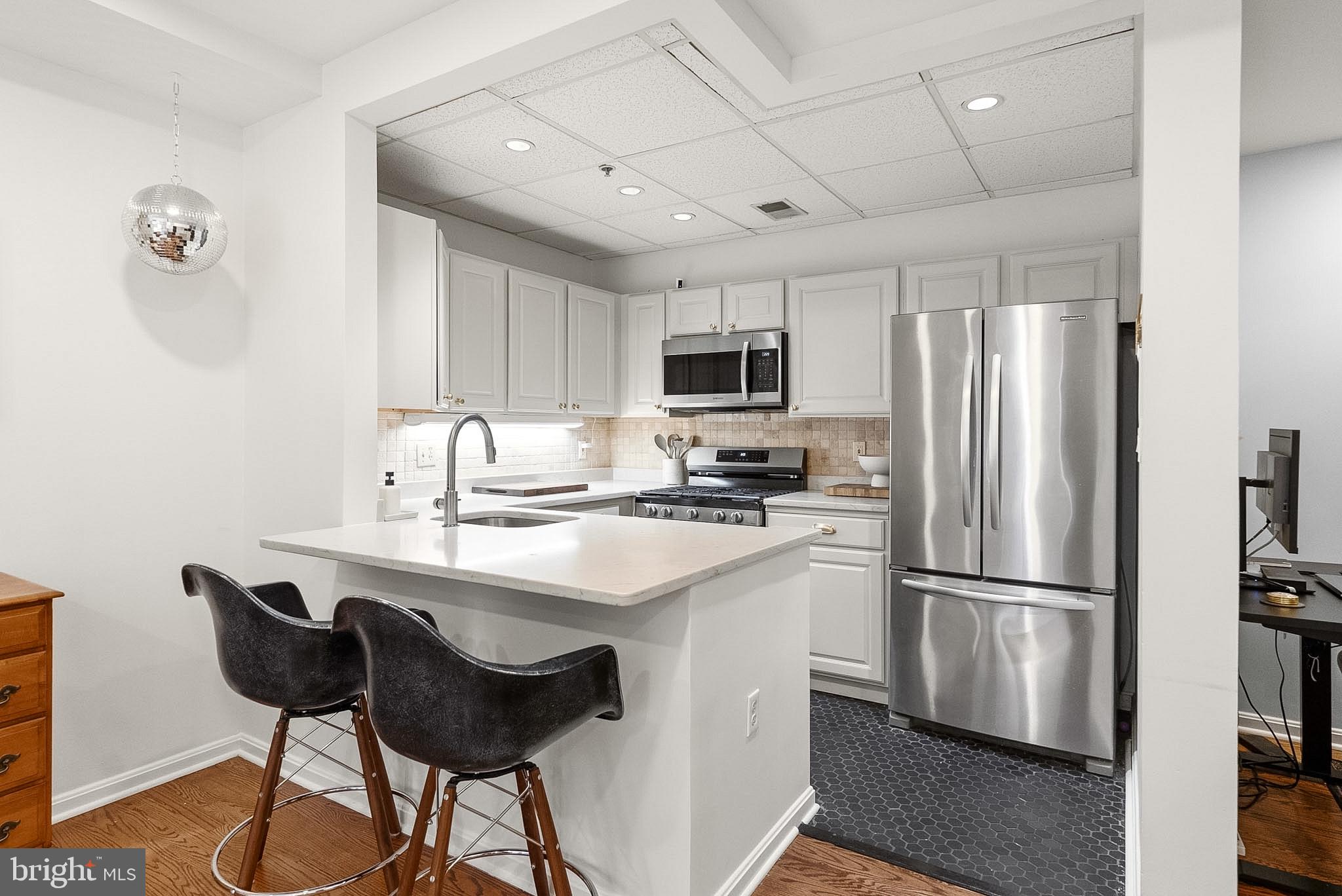 1935 Belmont Road Northwest, Unit 1121 Washington, DC 20009 - Photo 7 of 20 Modern kitchen with sleek finishes.