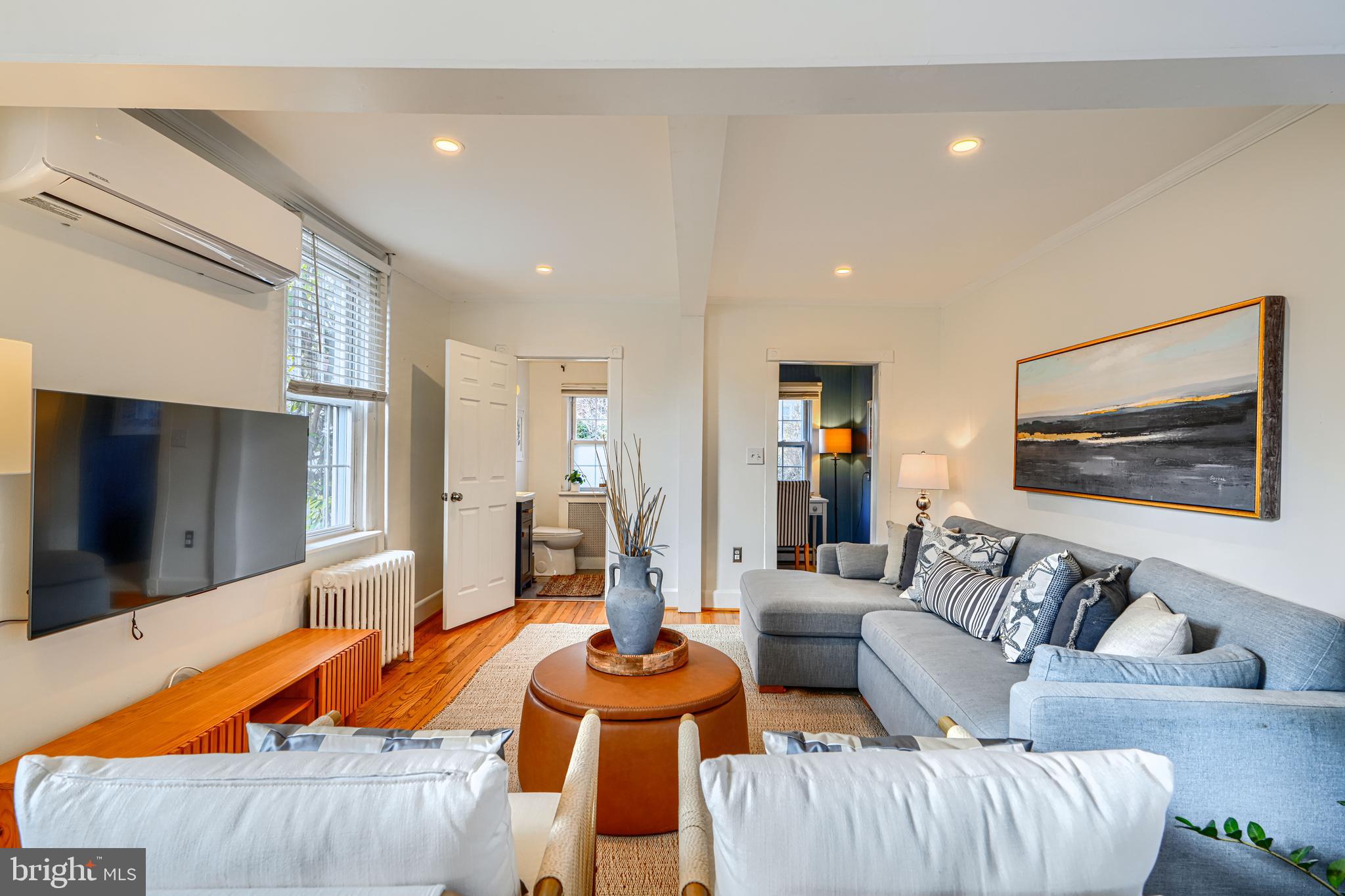 4511 Keswick Road Baltimore, MD 21210 - Photo 11 of 78 Living room view towards half bath and office