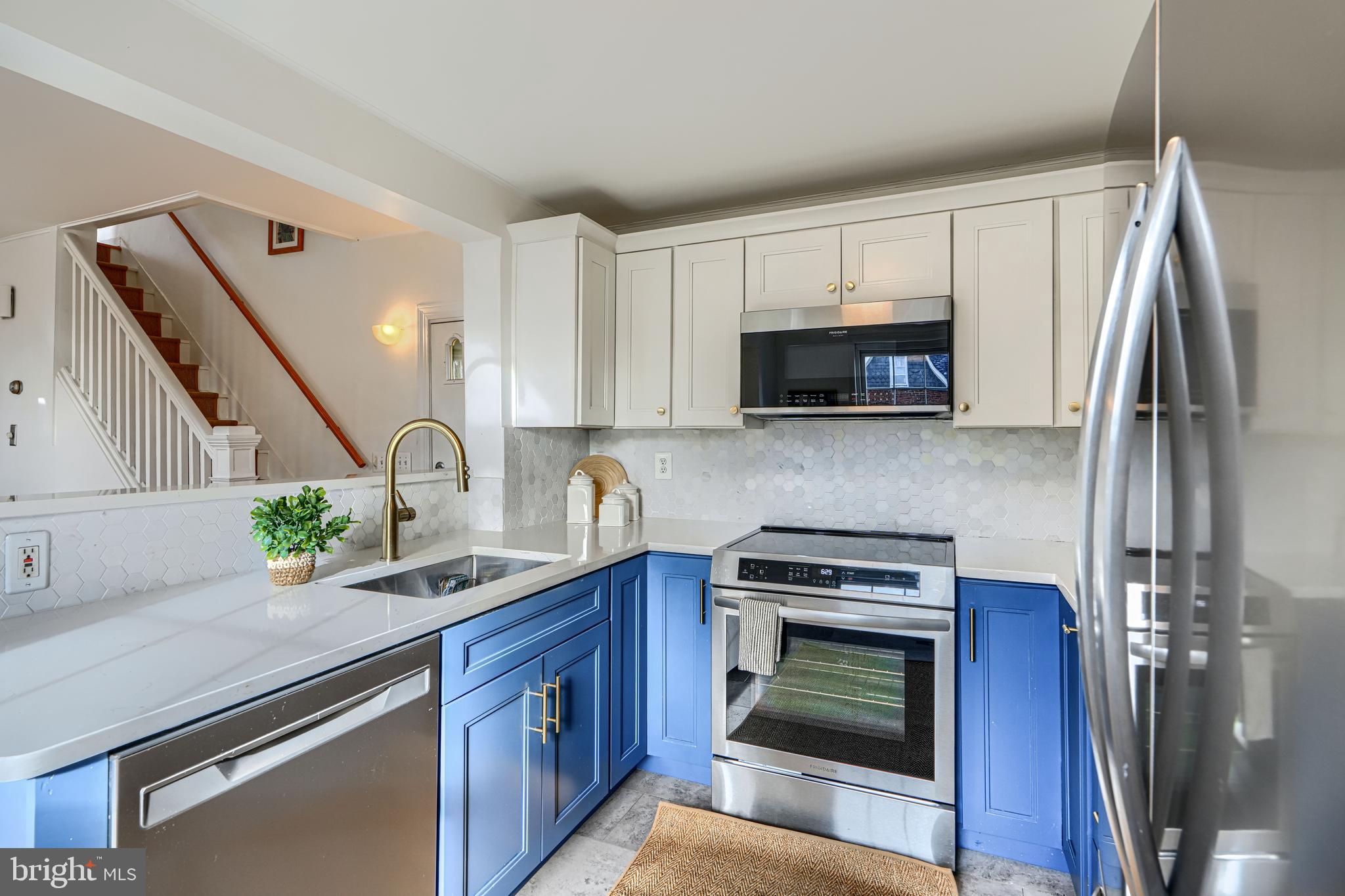 4511 Keswick Road Baltimore, MD 21210 - Photo 32 of 78 Stainless steel induction stove & tile backsplash