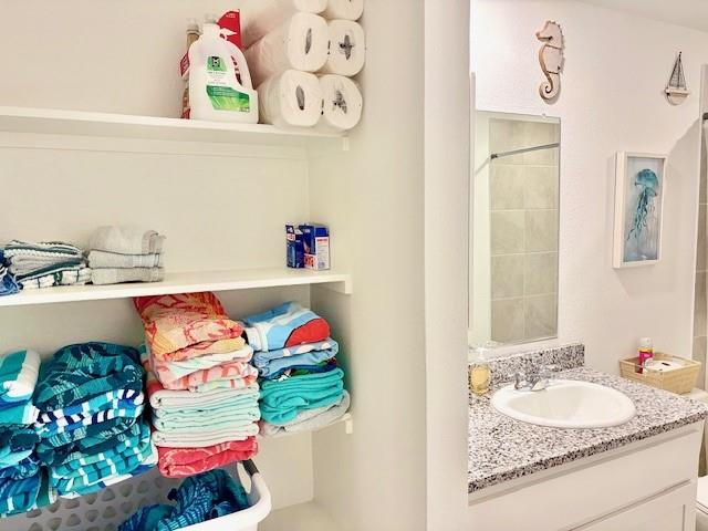 464 Reverie Way Ferris, TX 75125 - Photo 15 of 21 a bathroom with a sink and a mirror