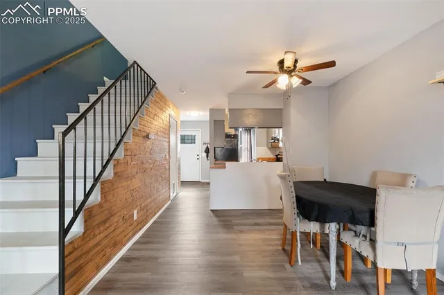 a view of a dining room with furniture and wooden floor