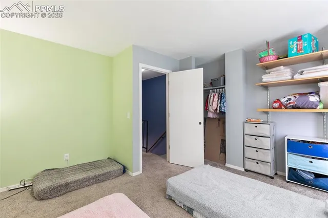 a bedroom with a bed and a cabinets