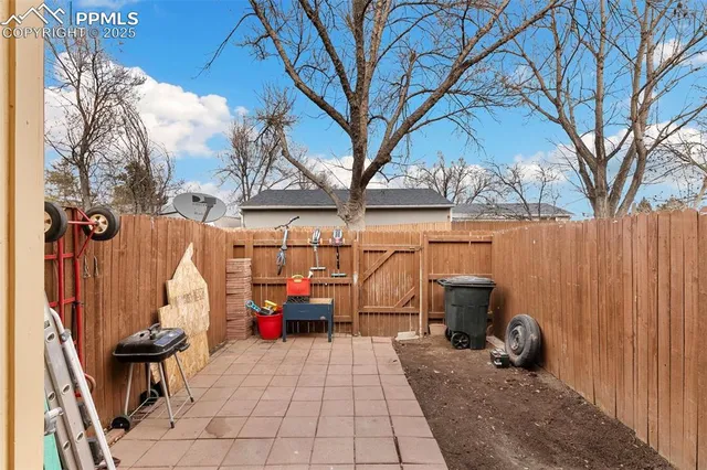 a backyard of a house with seating space