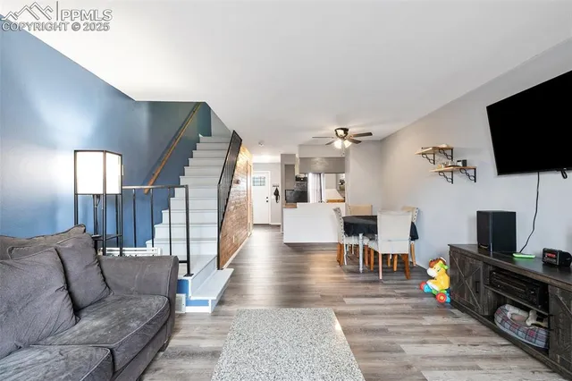 a living room with furniture and a flat screen tv