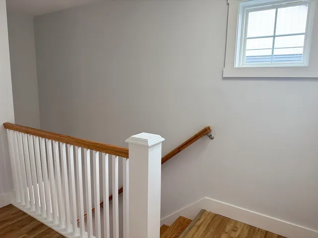 a view of a hallway with windows