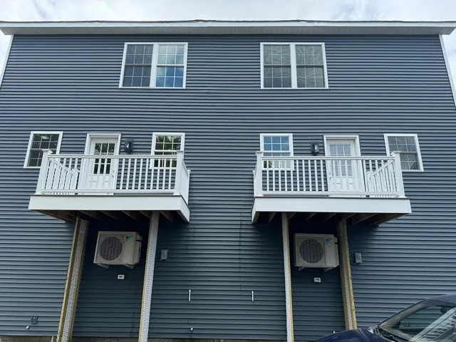 a front view of a house with a deck