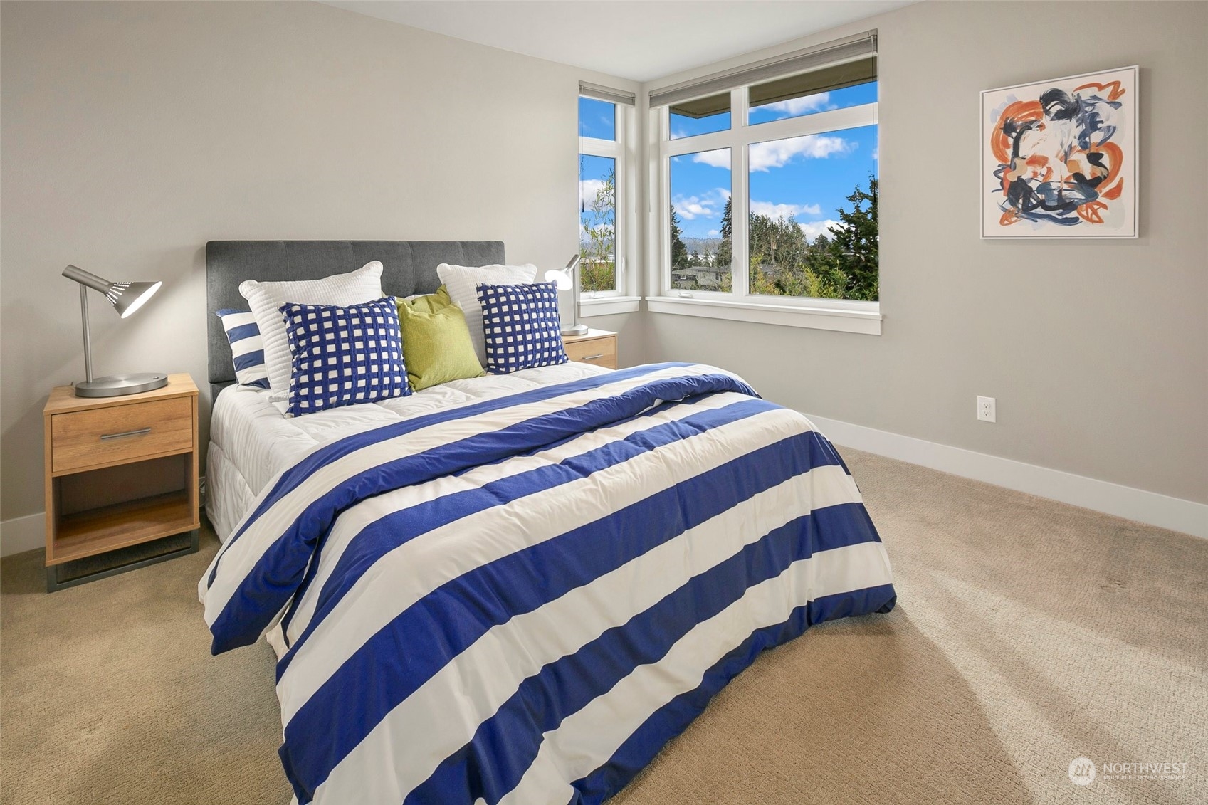 925 3rd Street West Kirkland, WA 98033 - Photo 25 of 40 a bedroom with a bed and a painting on the wall