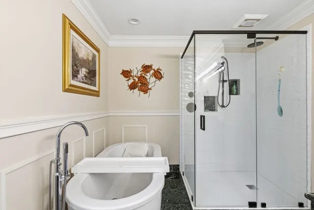 a picture of a bathroom with a tub and shower