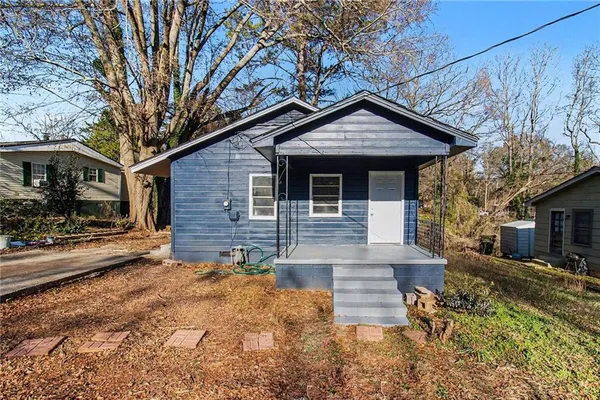 a view of a house with a yard