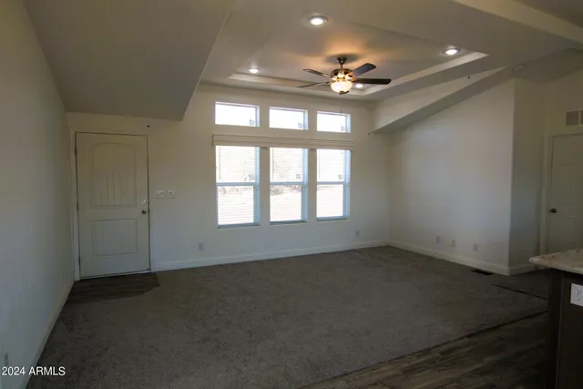 a view of a yard with a tree