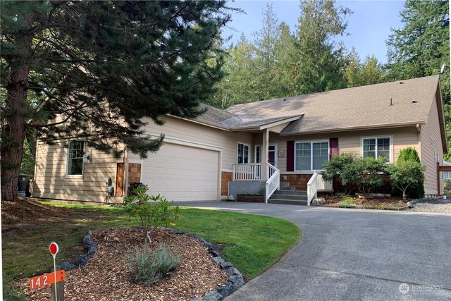 a view of a livingroom with wooden floor
