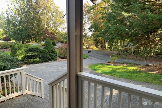 a view of swimming pool with outdoor seating and city view