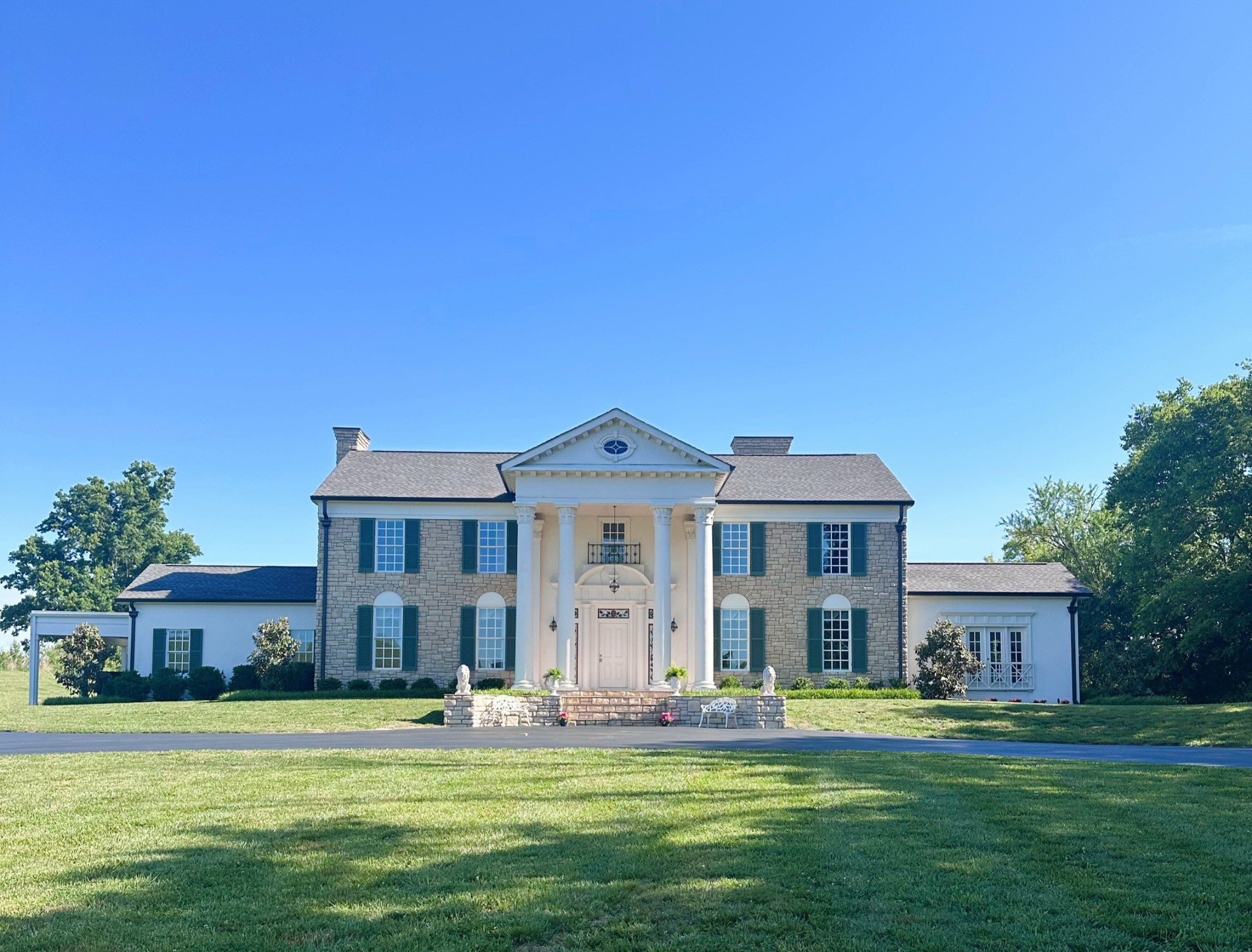 750 Walker Road Beechgrove, TN 37018 - Photo 47 of 50 a front view of a house with a garden and trees