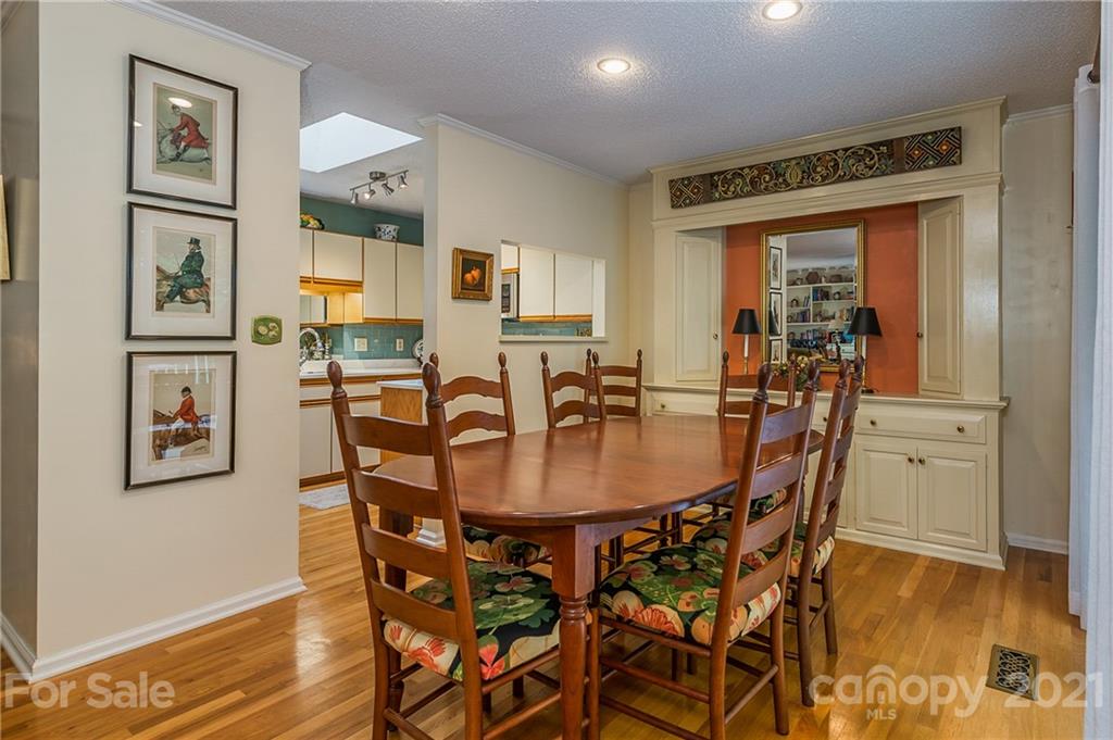 77 Chestnut Street, Unit 402 Tryon, NC 28782 - Photo 8 of 35 a view of a dining room with furniture