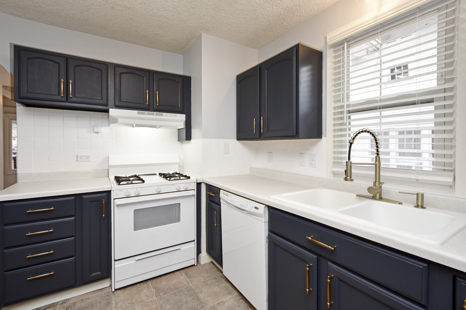 615 North Mulberry Street Clinton, IL 61727 - Photo 11 of 40 a kitchen with sink a stove and cabinets