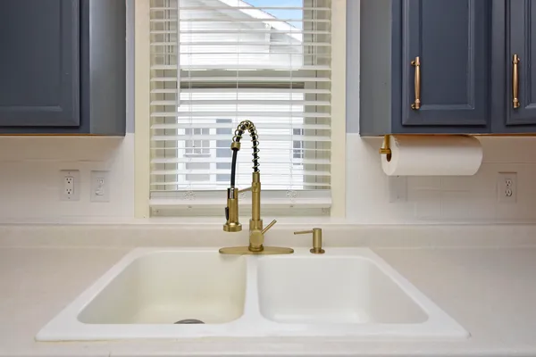 a bathroom with a sink and a window