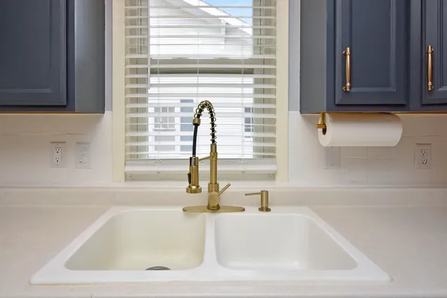 a bathroom with a sink and a window