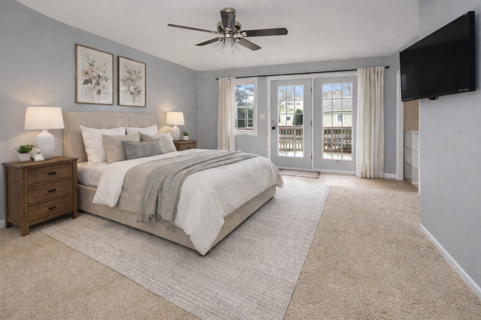 615 North Mulberry Street Clinton, IL 61727 - Photo 15 of 40 a spacious bedroom with a large bed and a flat screen tv