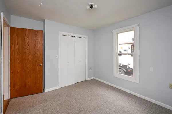a view of empty room with windows