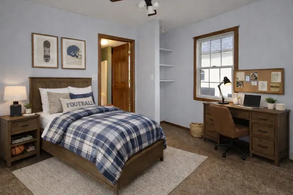 a bedroom with a bed and a window