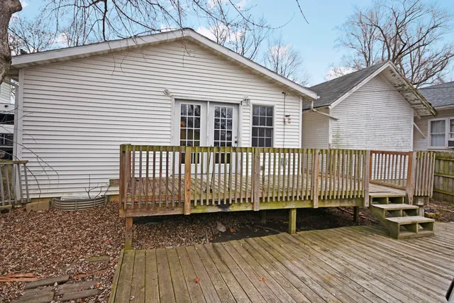 a view of a wooden roof with wooden floor and fence