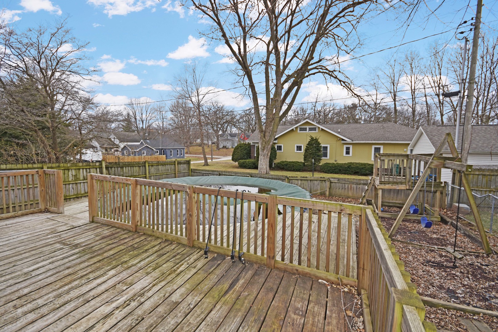 615 North Mulberry Street Clinton, IL 61727 - Photo 38 of 40 a view of a house with wooden deck next to a yard