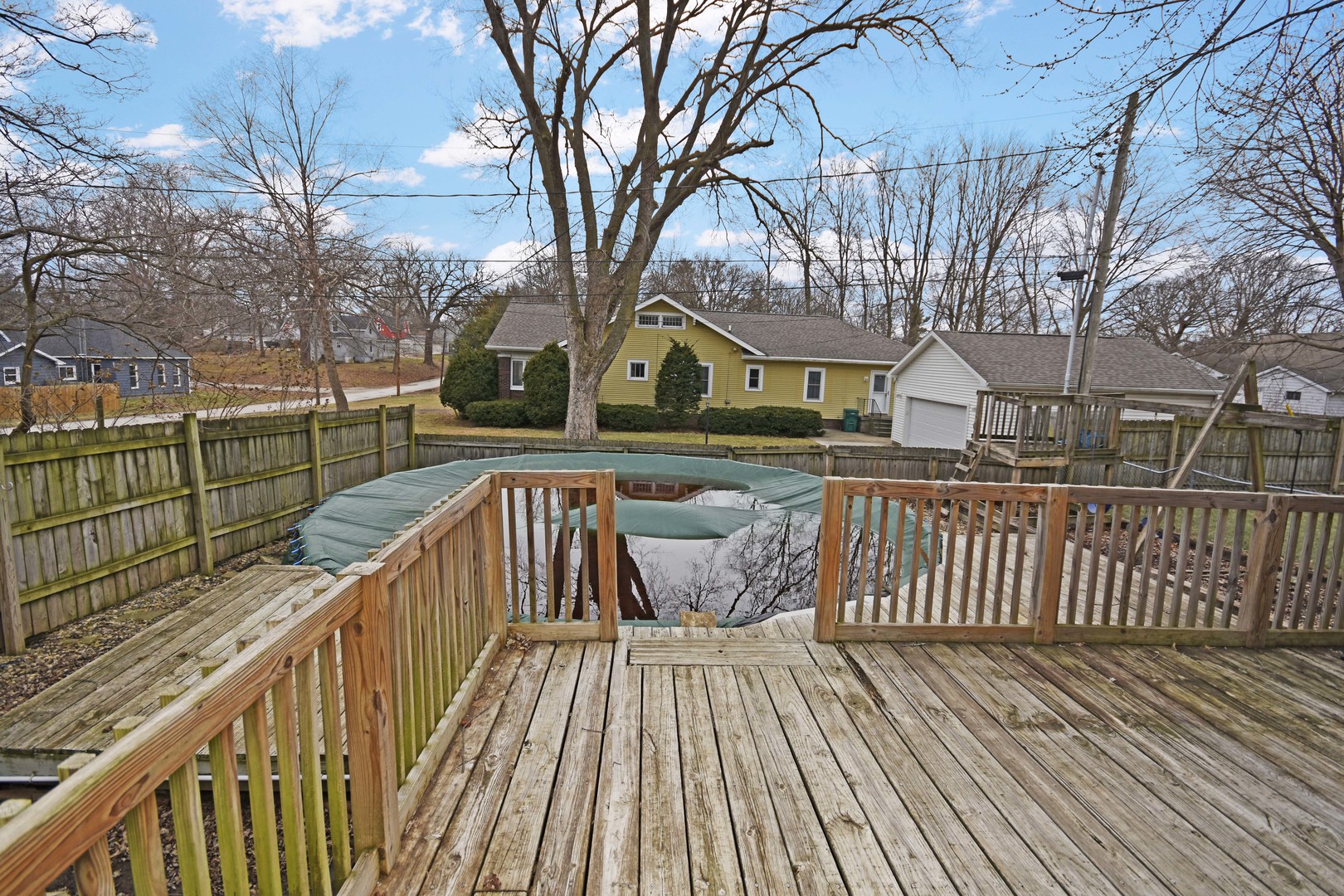 615 North Mulberry Street Clinton, IL 61727 - Photo 39 of 40 a view of a wooden deck with large trees