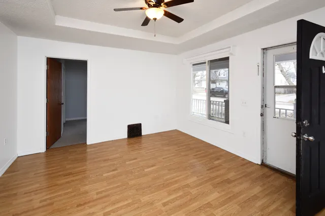 a view of an empty room with a window