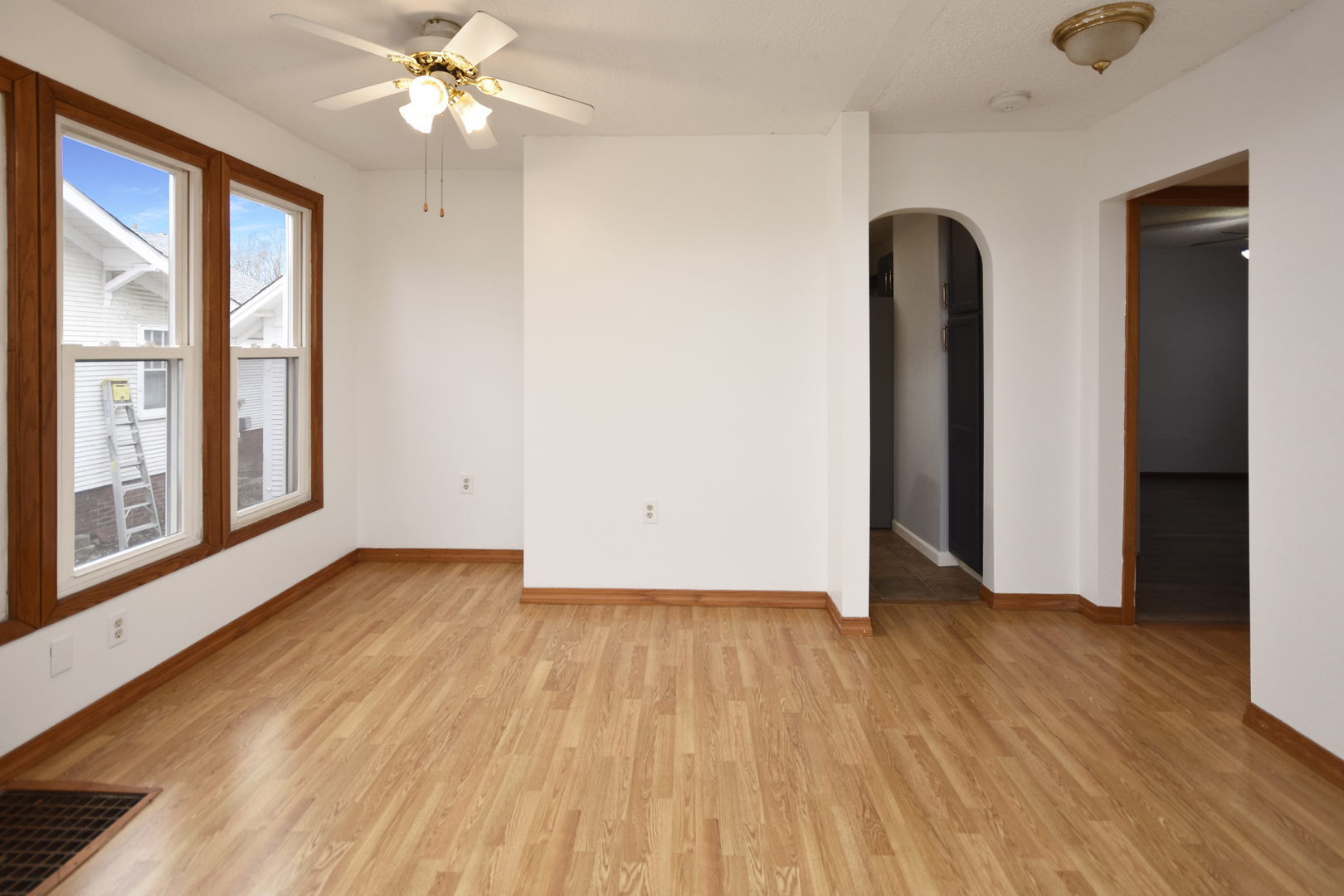 615 North Mulberry Street Clinton, IL 61727 - Photo 9 of 40 wooden floor in an empty room with a window