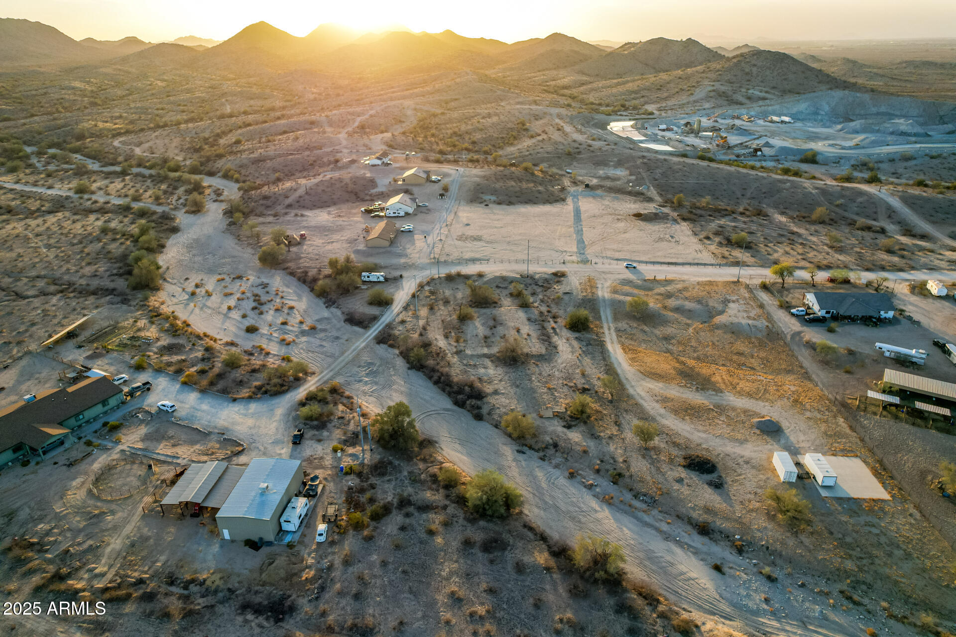 3815 West Broadway Road Buckeye, AZ 85326 - Photo 8 of 13 an aerial view of residential houses with outdoor space