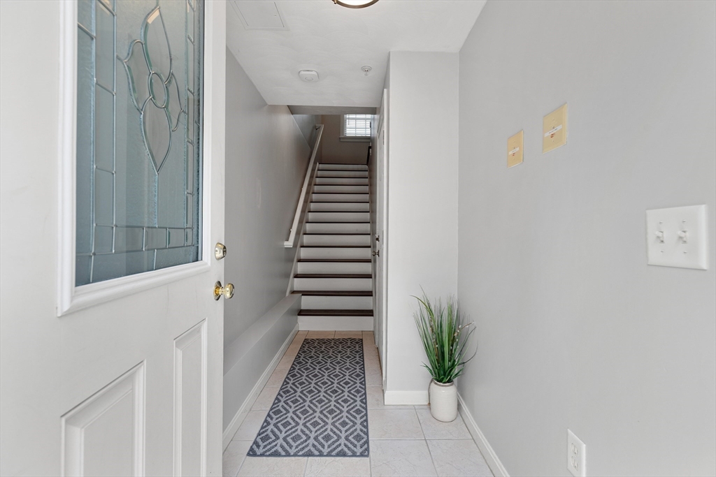 2 Ricciuti Drive, Unit 9 Quincy, MA 02169 - Photo 3 of 40 a view of entryway with a potted plant