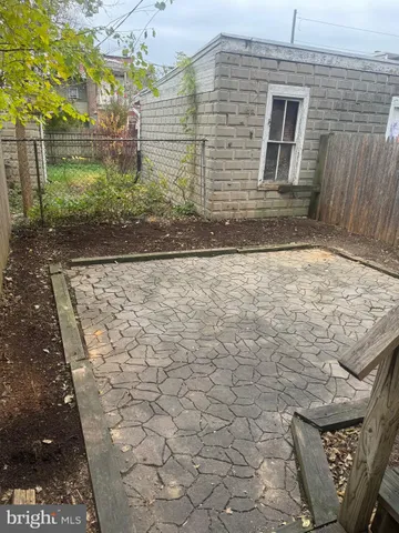 a view of house with backyard