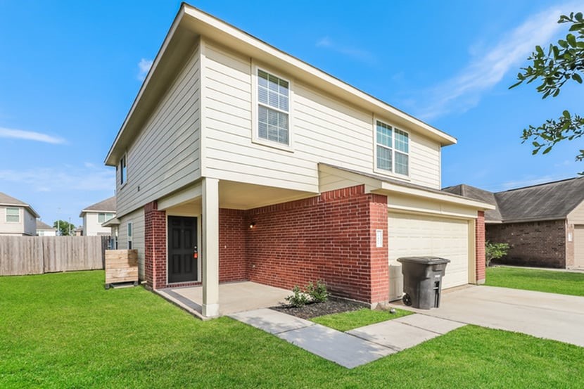 12423 Early Morning Drive Houston, TX 77048 - Photo 2 of 14 a view of a house with a yard and front view of a house