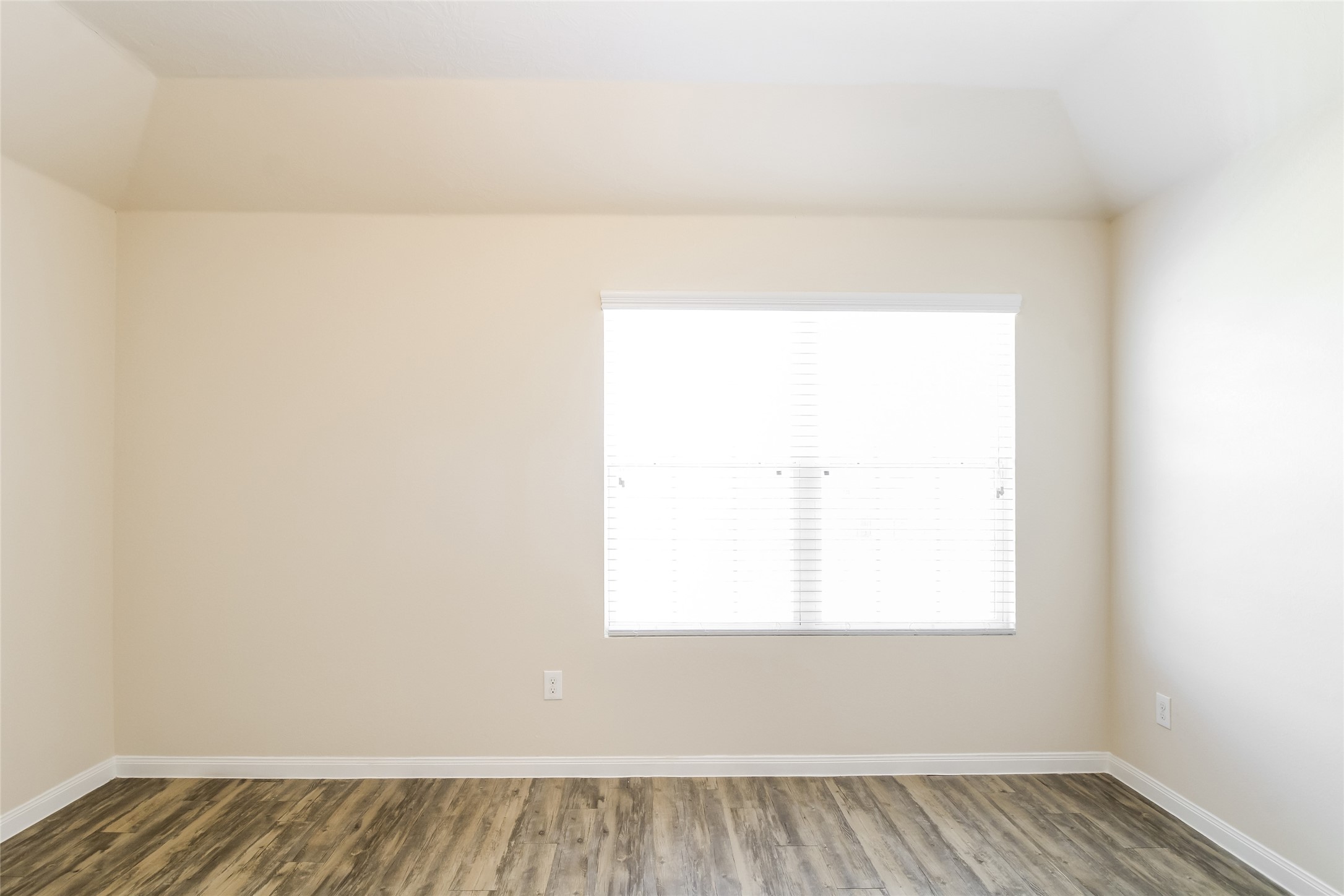 12423 Early Morning Drive Houston, TX 77048 - Photo 8 of 14 a view of a room with wooden floor and a window