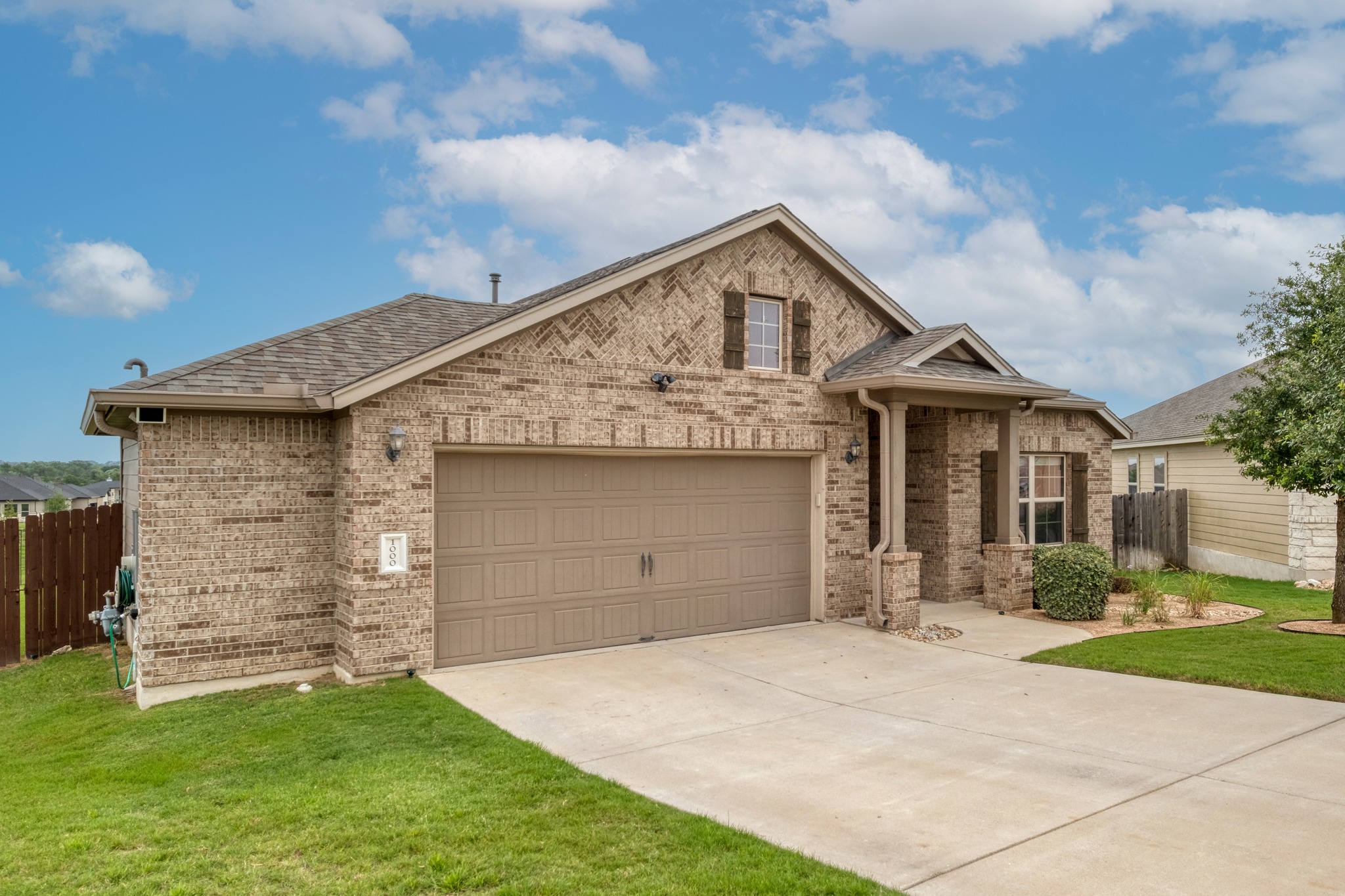 1000 Bright Star Cove Georgetown, TX 78628 - Photo 2 of 40 a front view of a house with a garden