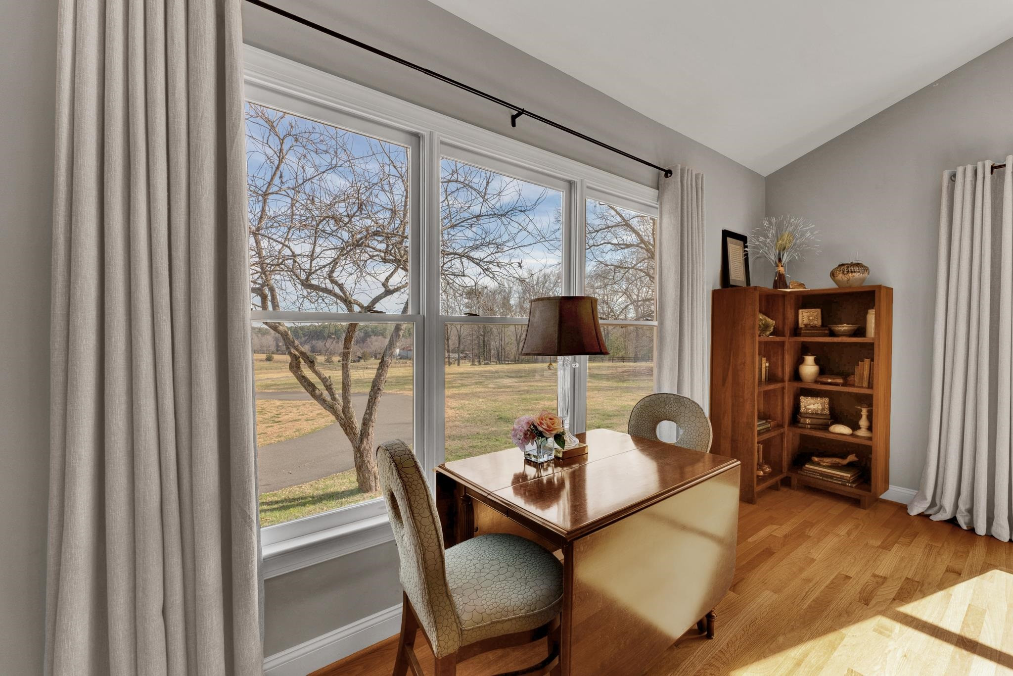 513 Mason Road Durham, NC 27712 - Photo 35 of 70 a view of a workspace with furniture and a large window