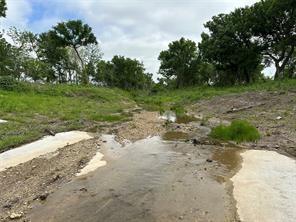 Lot 3 Ranchside Court Itasca, TX 76055 - Photo 7 of 22 a view of a dirt road with a building in the background