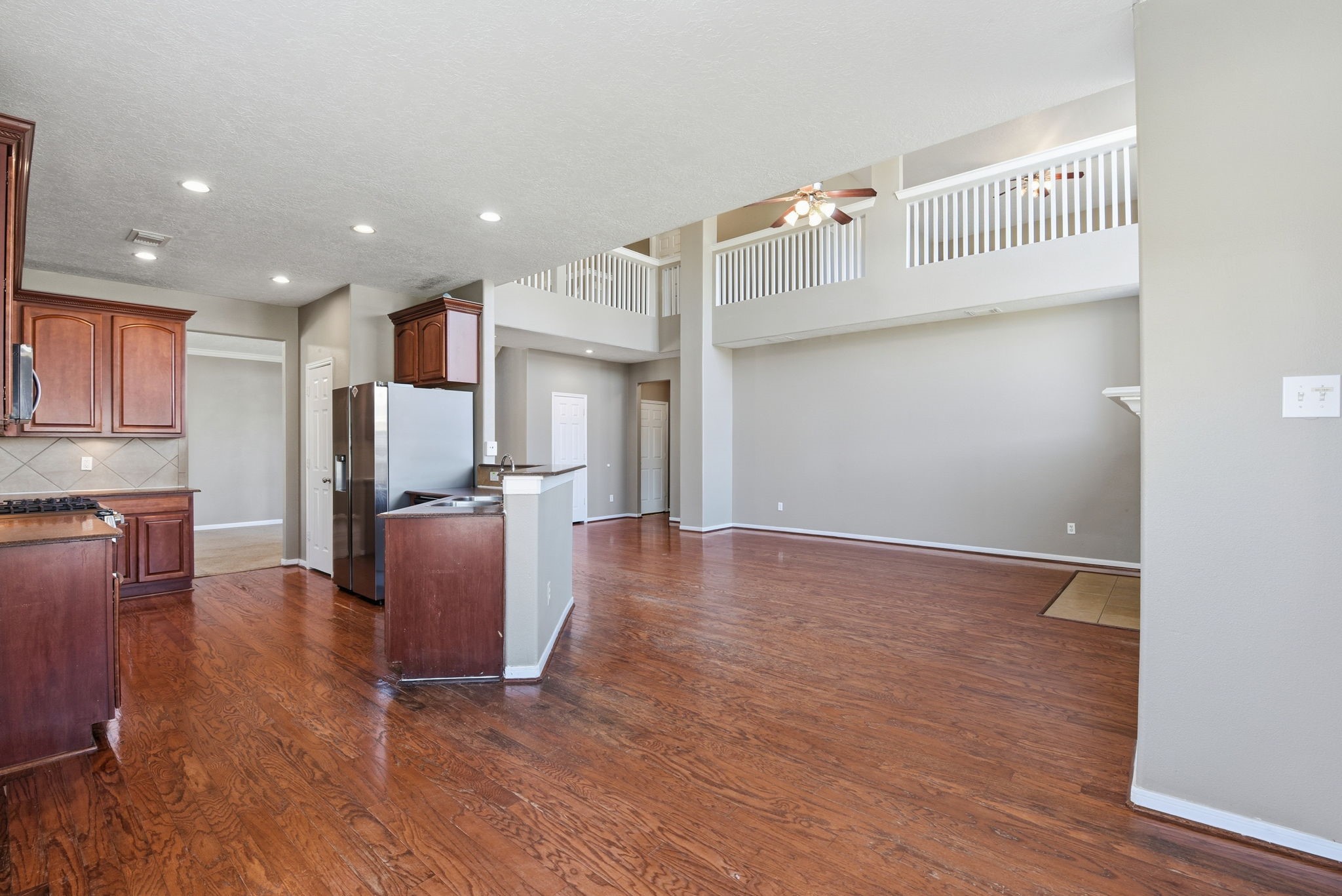 13902 Oneida Court Cypress, TX 77429 - Photo 14 of 48 a view of kitchen with furniture and wooden floor