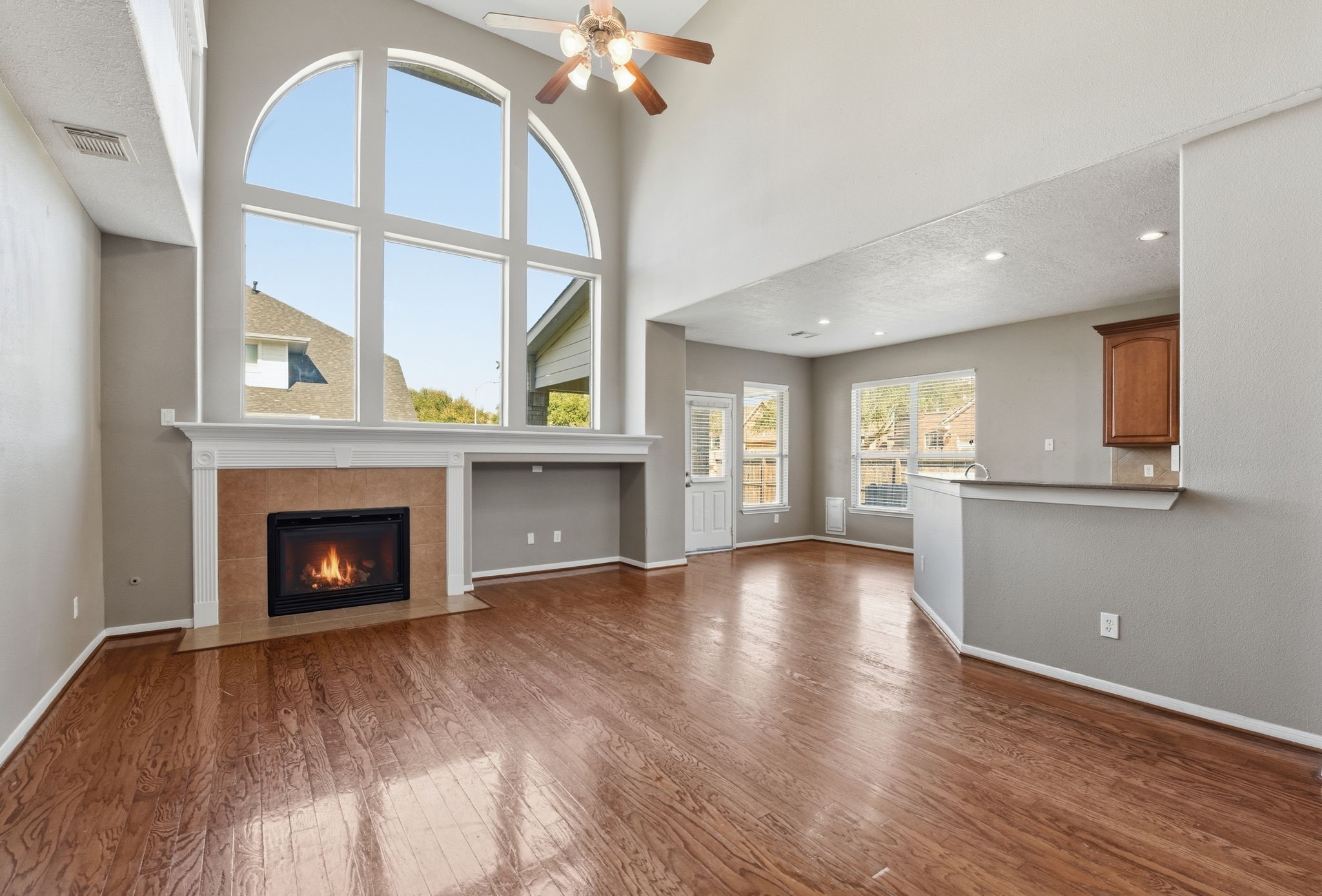 13902 Oneida Court Cypress, TX 77429 - Photo 19 of 48 a view of an empty room with a fireplace and a window