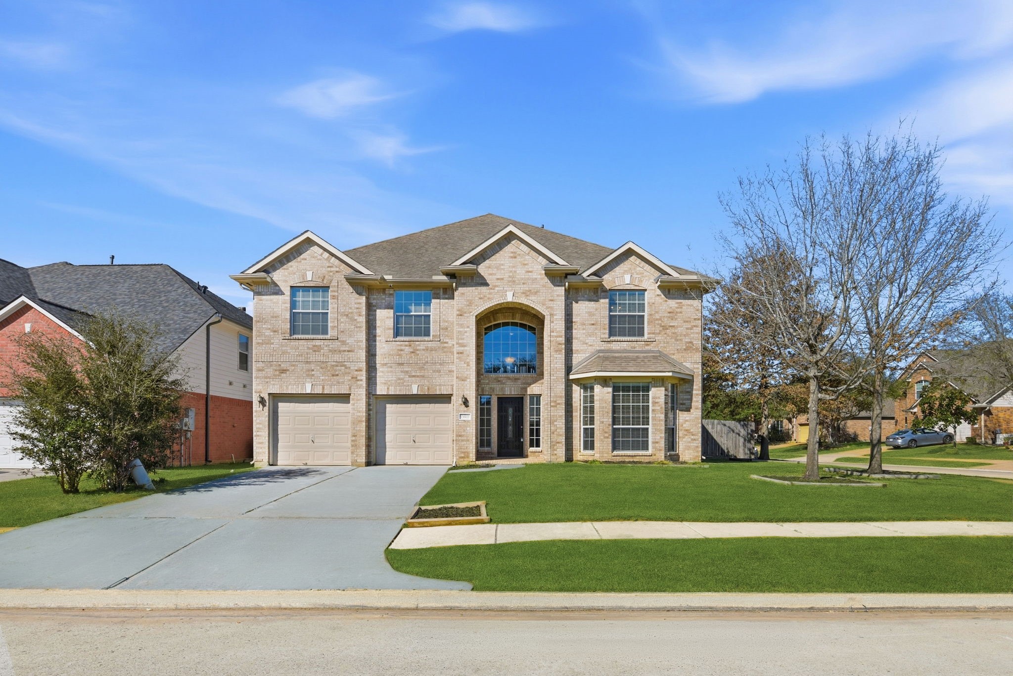 13902 Oneida Court Cypress, TX 77429 - Photo 2 of 48 a front view of a house with a yard